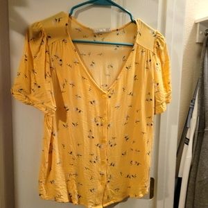 Yellow blouse with white flower pattern